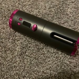 Brand new curling iron- ( spins to curl) comes with a usb charger